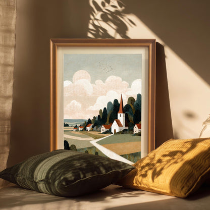 An orange-framed art print leaning against a beige wall, styled with cozy green and yellow pillows in soft, natural afternoon sunlight.
