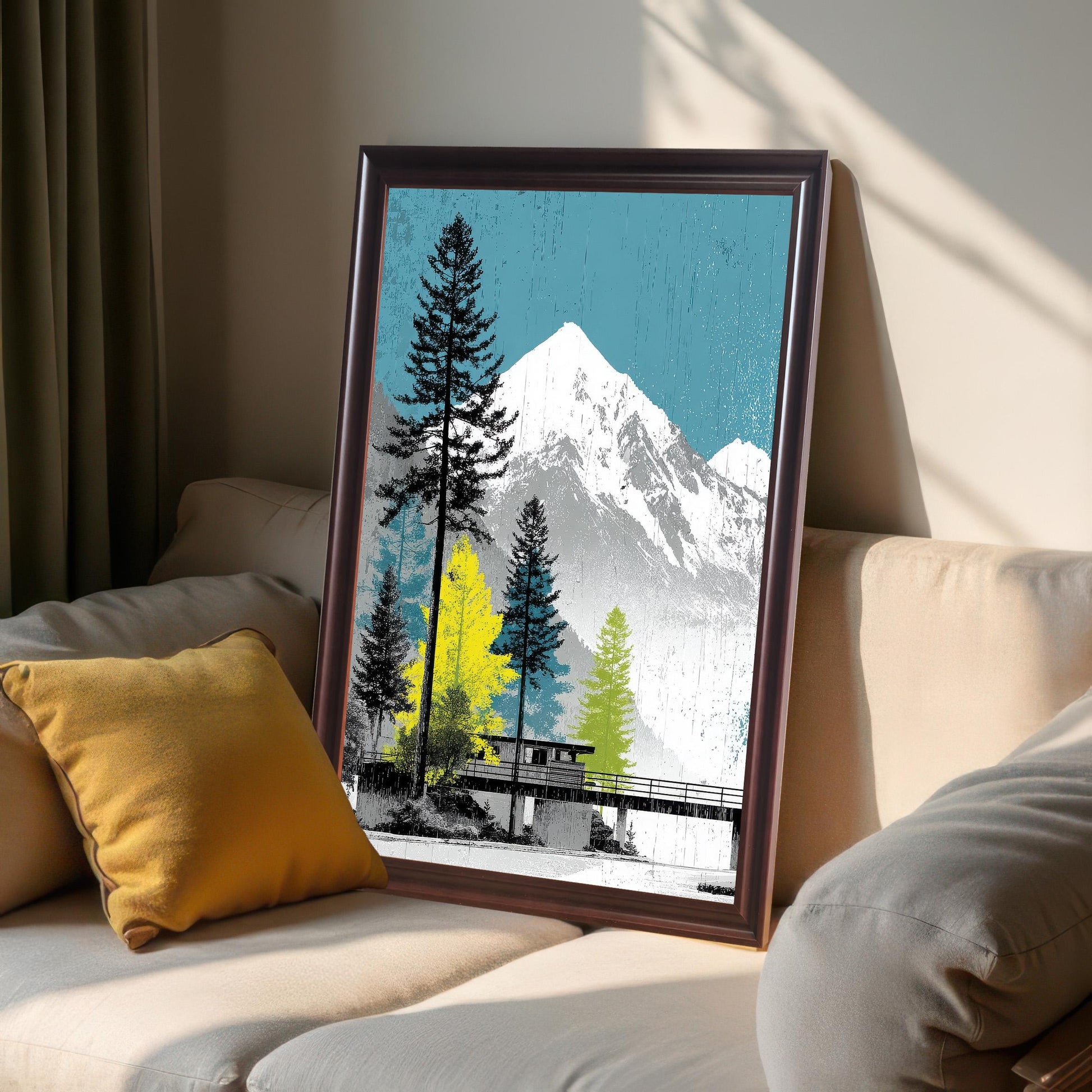 Coffee-colored dark wood frame featuring a mountain and forest art print, leaning against a neutral-toned sofa in natural sunlight.