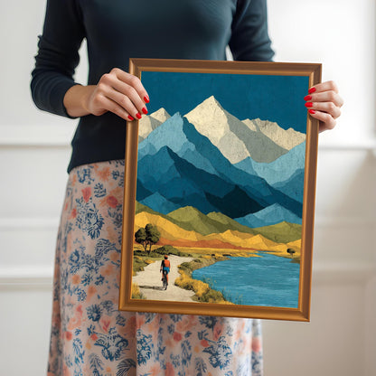 A person holding an orange wood-framed mountain landscape print to provide a real-world sense of size and frame quality.