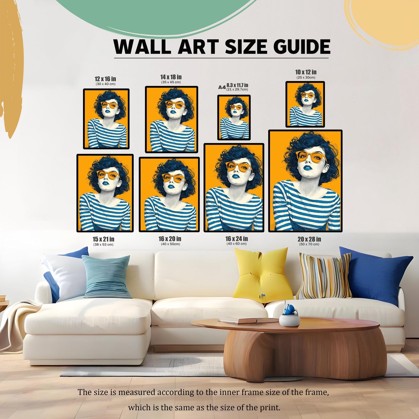 A wall art size guide showing various sizes of an art print featuring a woman with dark blue hair and orange glasses. The prints are arranged on a wall above a white sectional sofa.