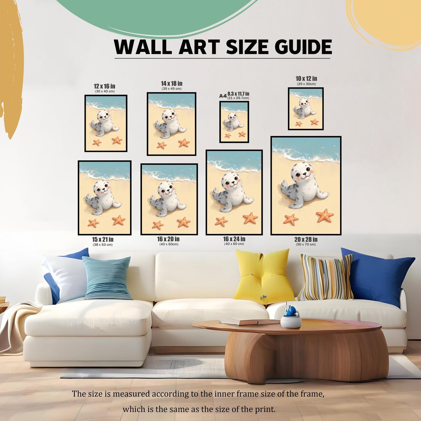 A wall art size guide showing various sizes of the baby seal print, from 8.3x11.7 inches to 20x28 inches. The prints are arranged over a white couch with blue and yellow pillows to demonstrate scale.