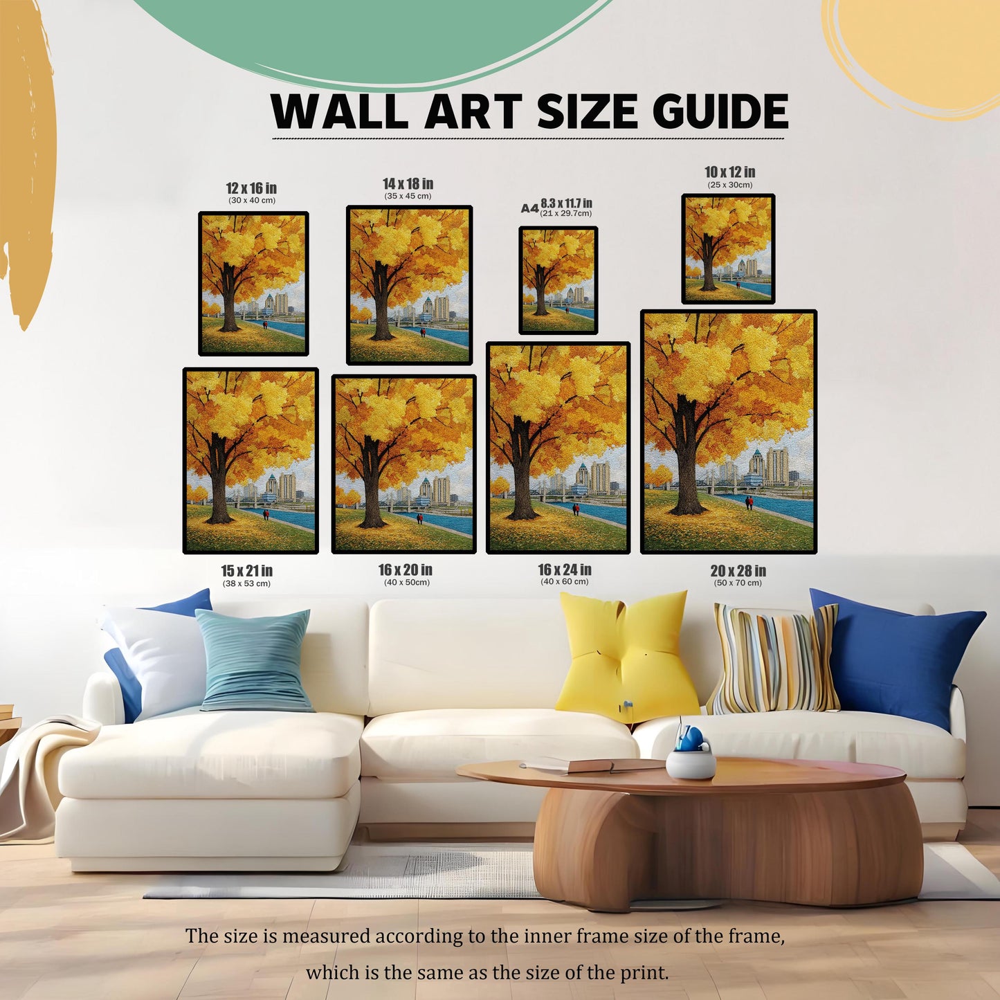 Wall Art Size Guide image showing a highly textured yellow autumn tree art print with a cityscape and river in the background, displayed in eight different sizes above a white couch for scale.