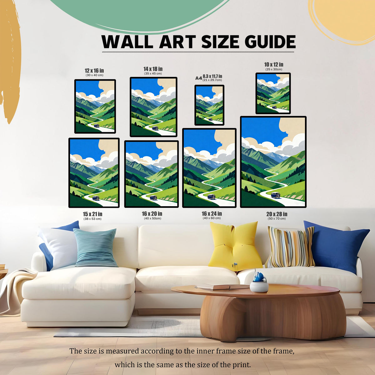 A Wall Art Size Guide graphic showing various print sizes (10x12, 12x16, 14x18, A4, 15x21, 16x20, 16x24, 20x28 inches) of the mountain road trip art, displayed above a large white sofa to demonstrate scale in a living room setting.