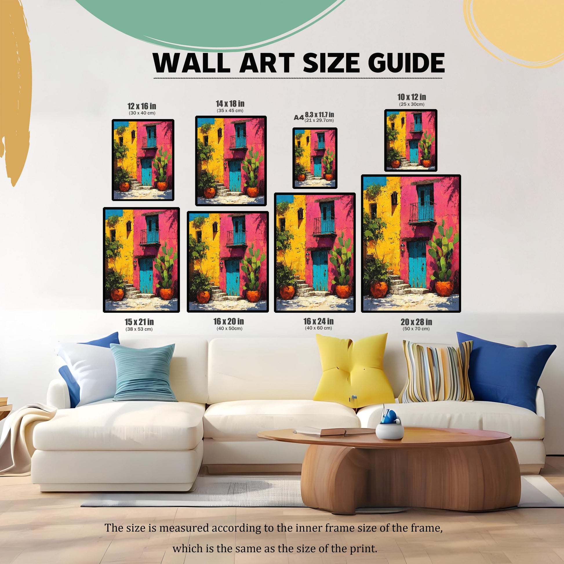 Wall Art Size Guide showing the framed colorful building print in eight different sizes placed above a white sectional sofa, including 12x16, 14x18, A4 (8.3x11.7), 10x12, 15x21, 16x20, 16x24, and 20x28 inches.
