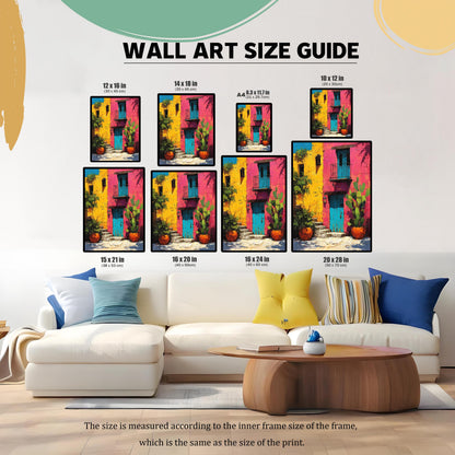 Wall Art Size Guide showing the framed colorful building print in eight different sizes placed above a white sectional sofa, including 12x16, 14x18, A4 (8.3x11.7), 10x12, 15x21, 16x20, 16x24, and 20x28 inches.
