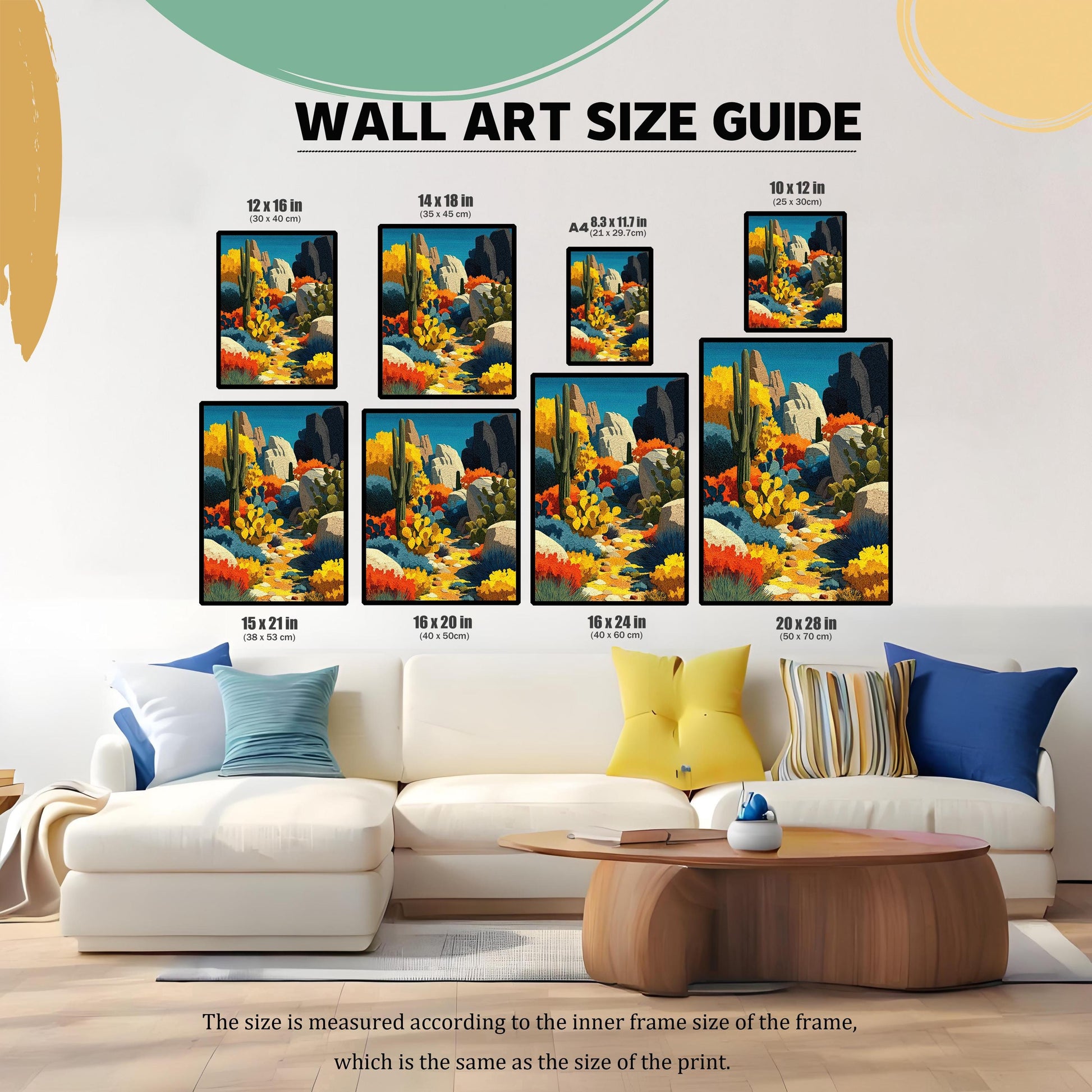 Wall art size guide showing seven different sizes of the framed desert landscape art print above a white couch, providing scale. Sizes include: 12x16 in, 14x18 in, A4, 10x12 in, 15x21 in, 16x20 in, 16x24 in, and 20x28 in.
