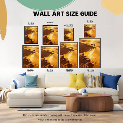 Wall Art Size Guide image showing the desert camel caravan print in various sizes arranged above a couch in a living room. Sizes listed include 12x16 in, 14x18 in, A4 (8.3x11.7 in), 10x12 in, 15x21 in, 16x20 in, 16x24 in, and 20x28 in.