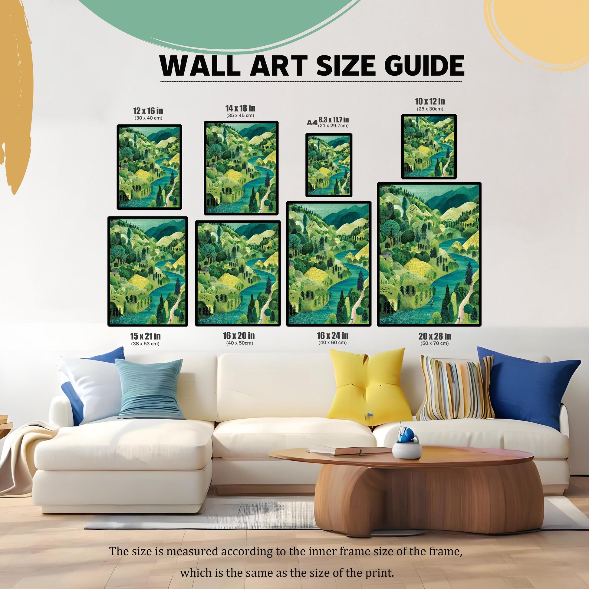 A WALL ART SIZE GUIDE showing the landscape print in eight different sizes, displayed above a white sofa with colorful pillows to illustrate scale. Sizes range from 8.3 x 11.7 in (A4) up to 20 x 28 in (50 x 70 cm).