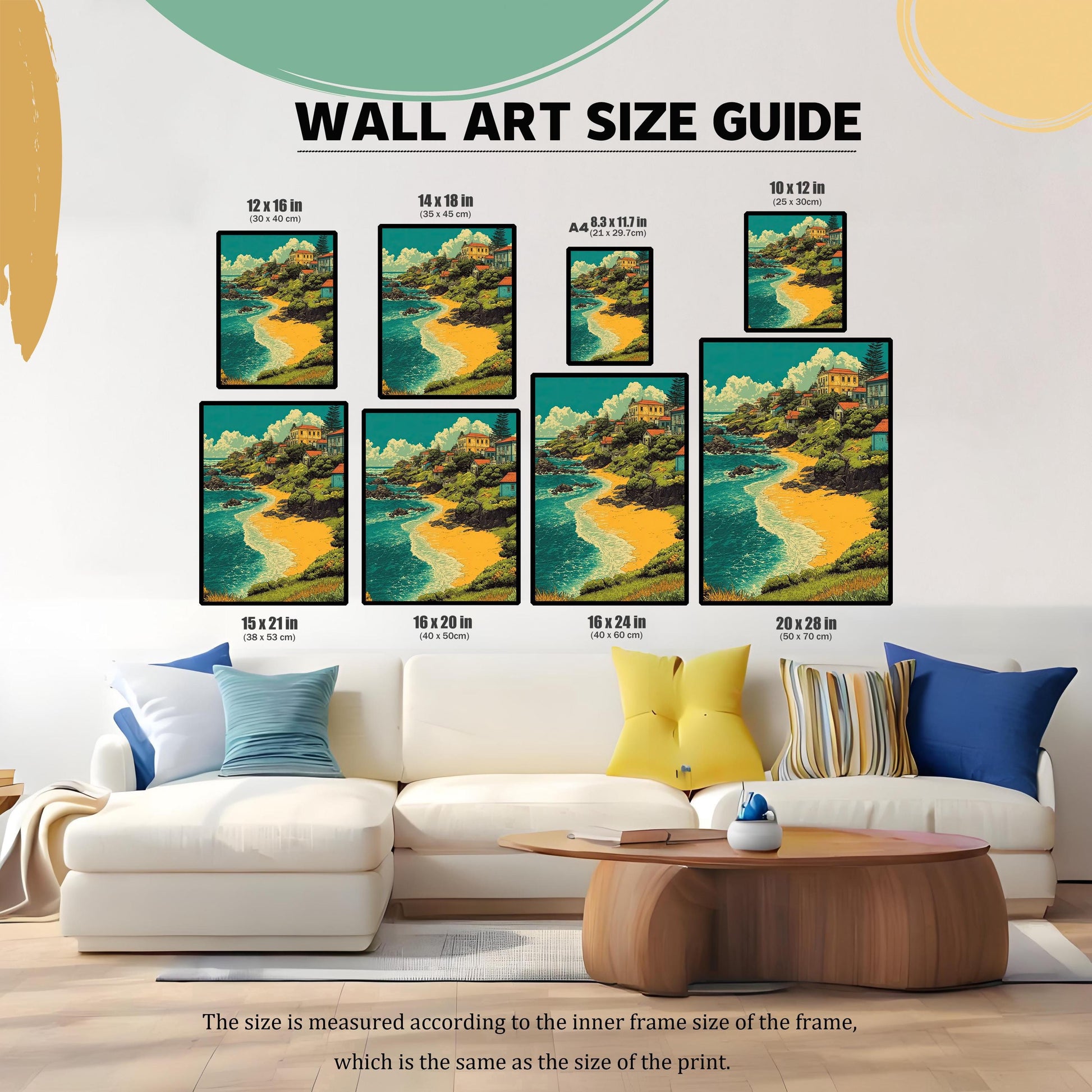 A wall art size guide displays a painting of a village by a beach in various frame sizes, from 8.3 x 11.7 inches (A4) to 20 x 28 inches. The frames are arranged on a wall above a white couch.