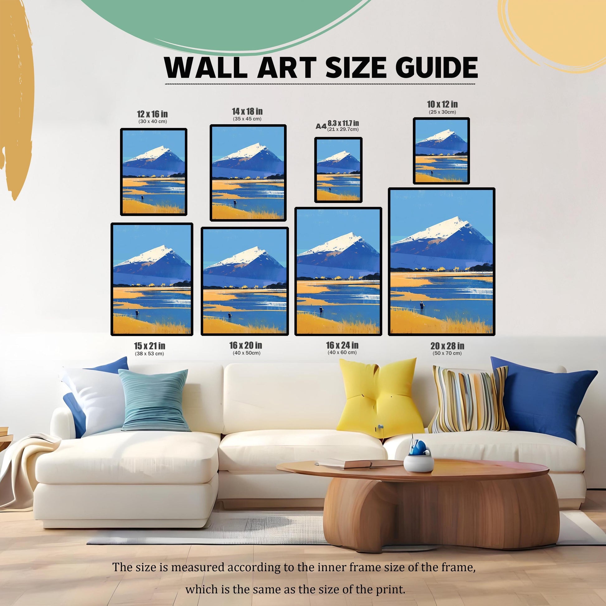 A "Wall Art Size Guide" showing eight different versions of the mountain print in various dimensions (ranging from  inches to  inches) hanging above a modern white L-shaped sofa. A note at the bottom explains that measurements refer to the inner frame size.
