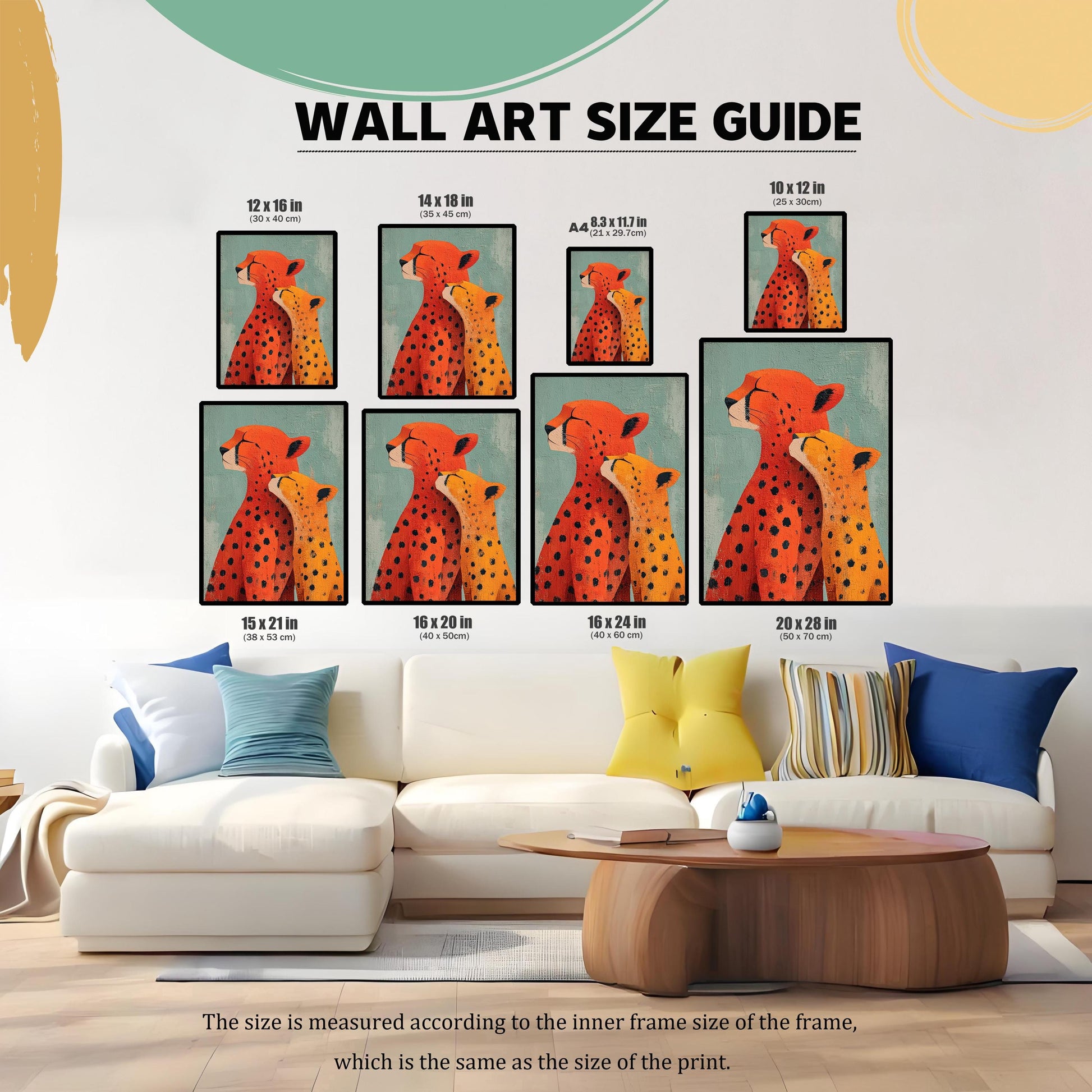 WALL ART SIZE GUIDE. Image showing eight different proportional sizes of the framed 'Cheetah Love' art print displayed above a white sofa in a modern living room setting. Sizes include 12x16 in, 14x18 in, 8.3x11.7 in (A4), 10x12 in, 15x21 in, 16x20 in, 16x24 in, and 20x28 in.