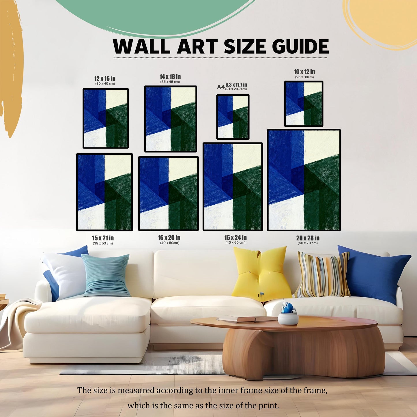 Wall Art Size Guide chart showing various framed print sizes displayed above a large white sectional sofa. Sizes include 12x16, 14x18, A4, 10x12, 15x21, 16x20, 16x24, and 20x28 inches (with centimeter equivalents). The artwork is a blue and green geometric abstract print.