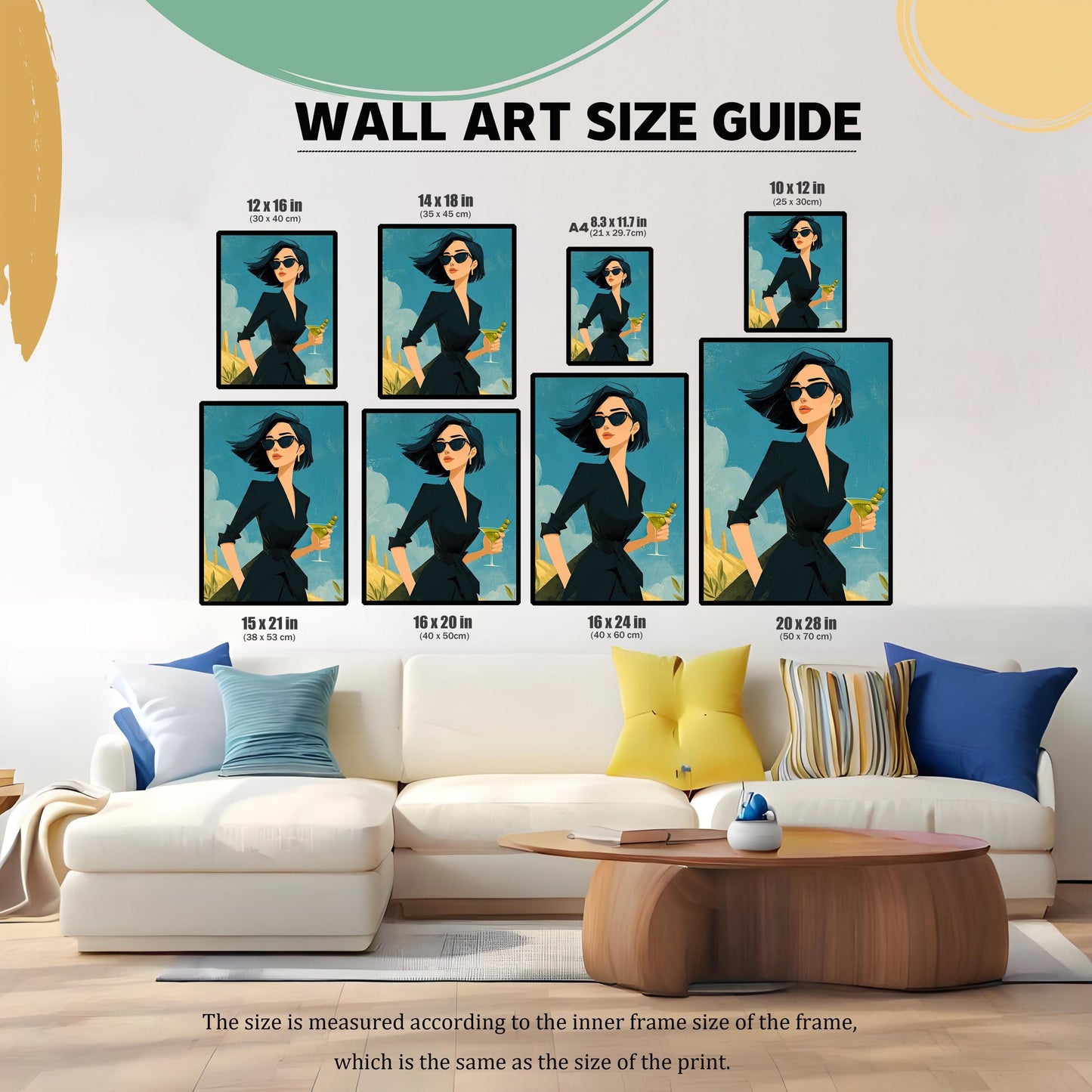 A wall art size guide showing the same art print in various dimensions, displayed on a wall above a white couch with different colored pillows.
