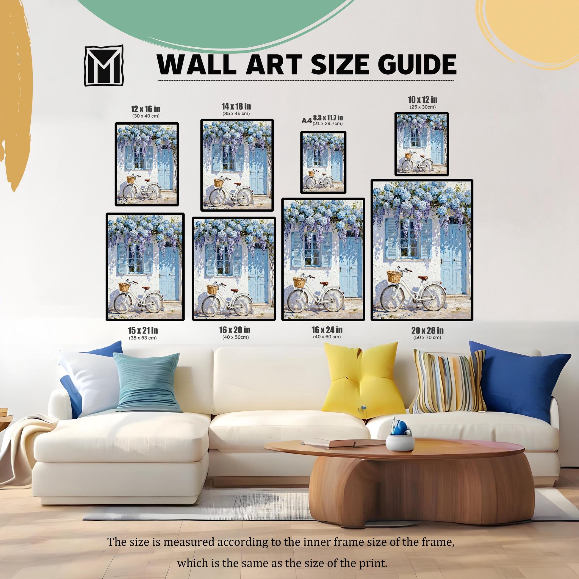 Wall art size guide showing various framed print dimensions (10x12, 12x16, 14x18, A4, 15x21, 16x20, 16x24, 20x28 inches) with the bicycle print for scale, displayed above a white sofa.