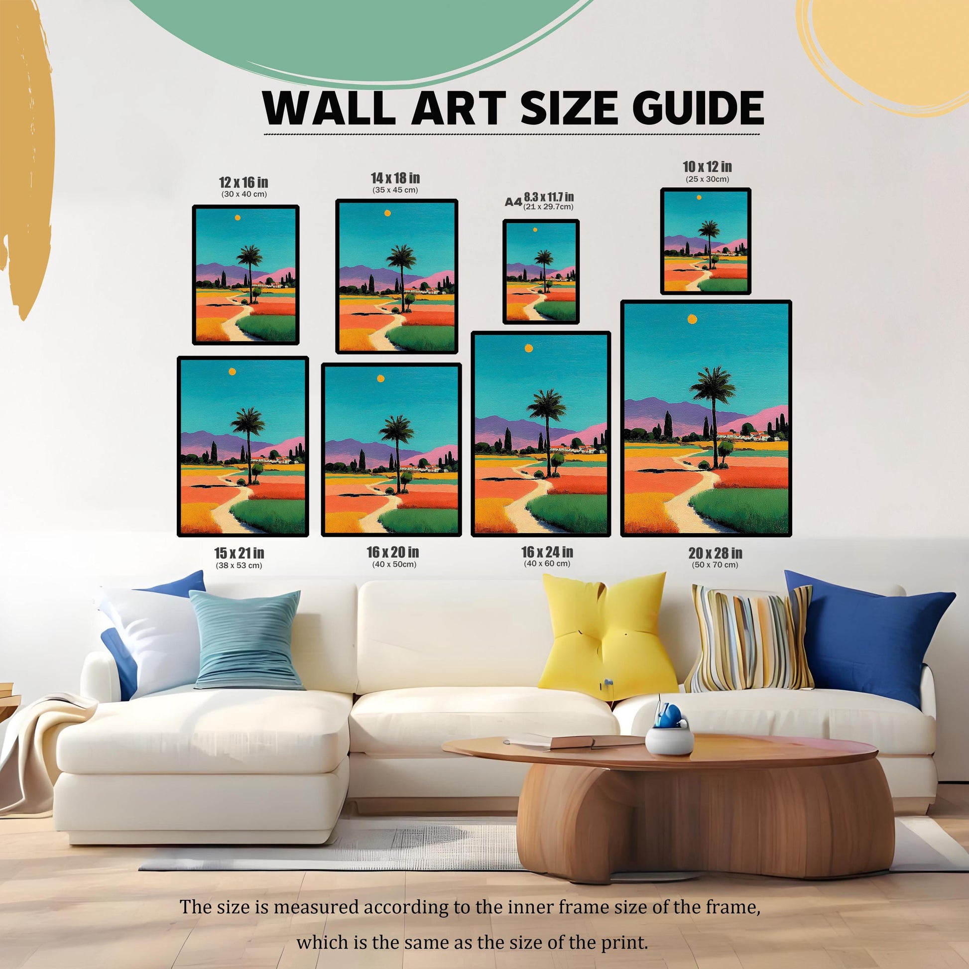 Wall art size guide showing seven different print dimensions in inches and centimeters (e.g., 12x16 in, 16x24 in), displayed over a white couch.