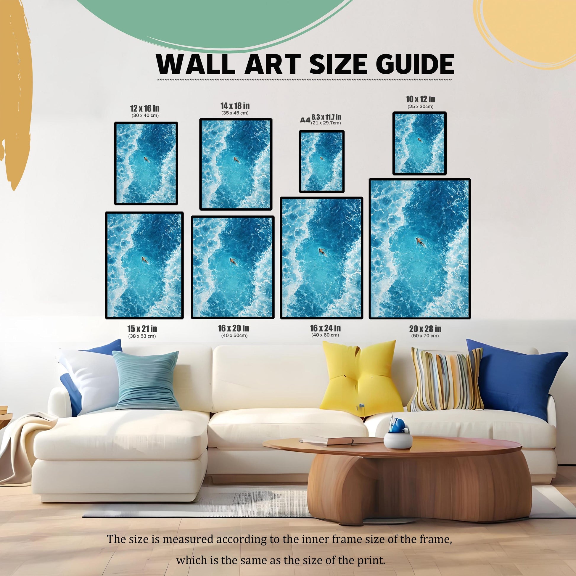 Wall Art Size Guide showing nine different sizes of the ocean art print hung above a white sectional couch, ranging from 8.3 x 11.7 in (A4) to 20 x 28 in (50 x 70 cm), illustrating the scale of each print relative to the furniture.