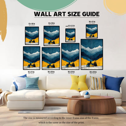 A ""WALL ART SIZE GUIDE"" image showing a watercolor print of a winter landscape with mountains and a yellow house, displayed in various frame sizes (12x16, 14x18, A4, 10x12, 15x21, 16x20, 16x24, 20x28 inches) over a white couch in a living room.