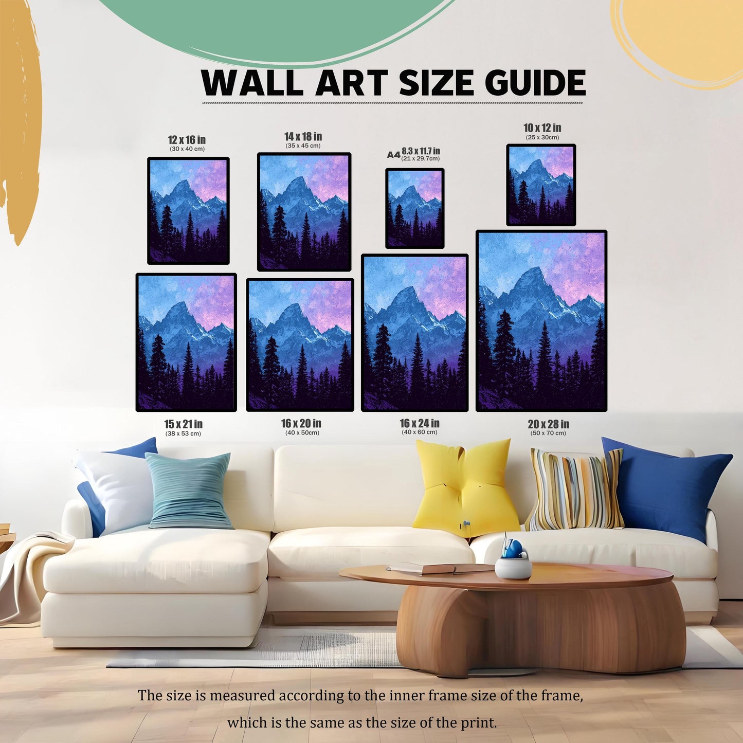 A WALL ART SIZE GUIDE graphic showing eight different size prints (12x16, 14x18, A4, 10x12, 15x21, 16x20, 16x24, 20x28 inches) featuring the mountain print, displayed above a large white sectional couch with colorful pillows, illustrating scale.