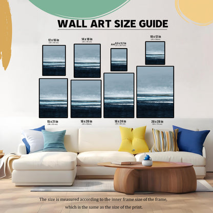 Wall Art Size Guide graphic showing eight different framed sizes (e.g., 12×16 in, 16×24 in, A4) for the seascape print. The guide is superimposed over a white sectional couch in a living room, illustrating the print's scale.