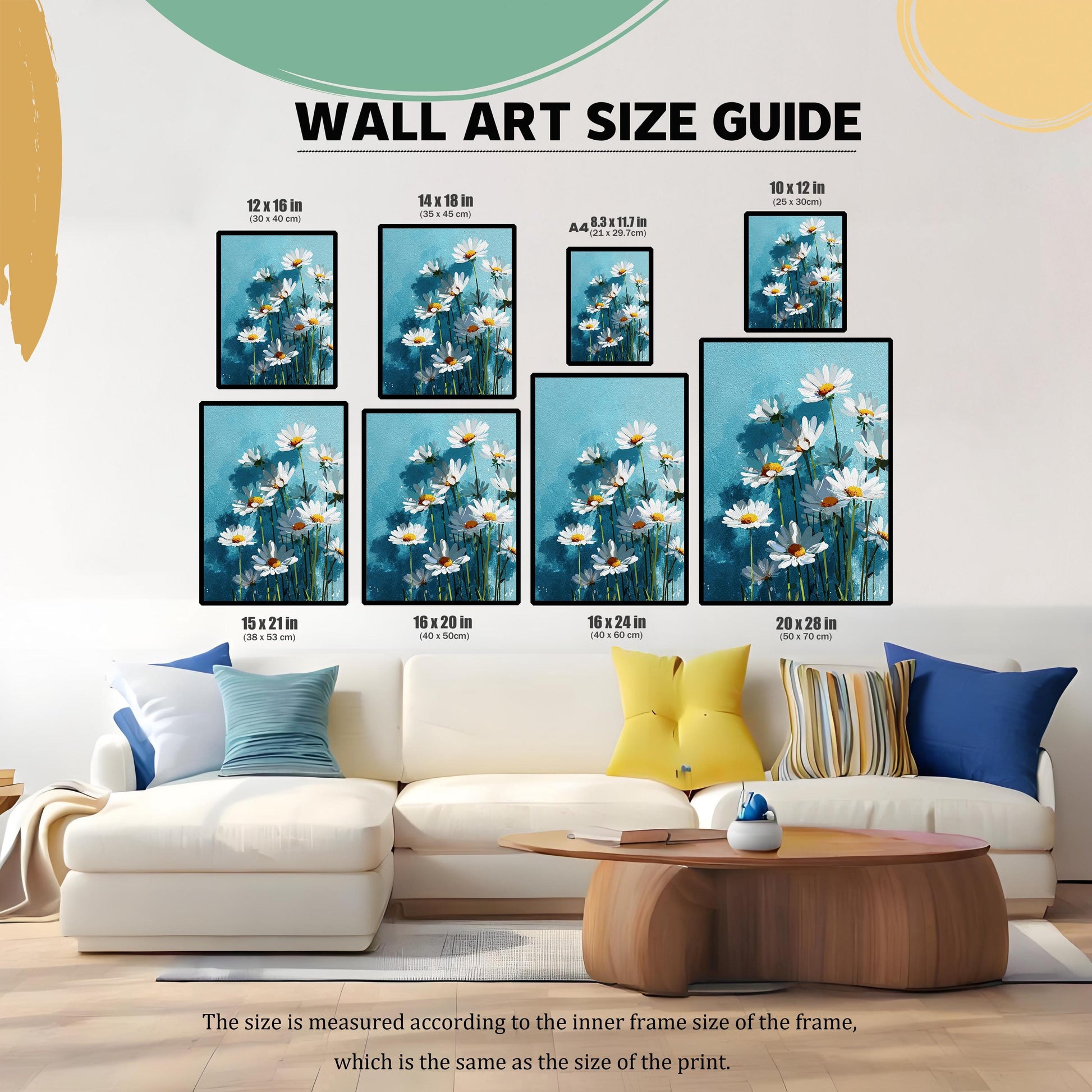 A living room with a couch and coffee table, showing multiple sizes of wall art with a daisy pattern arranged on the wall to demonstrate a size guide.