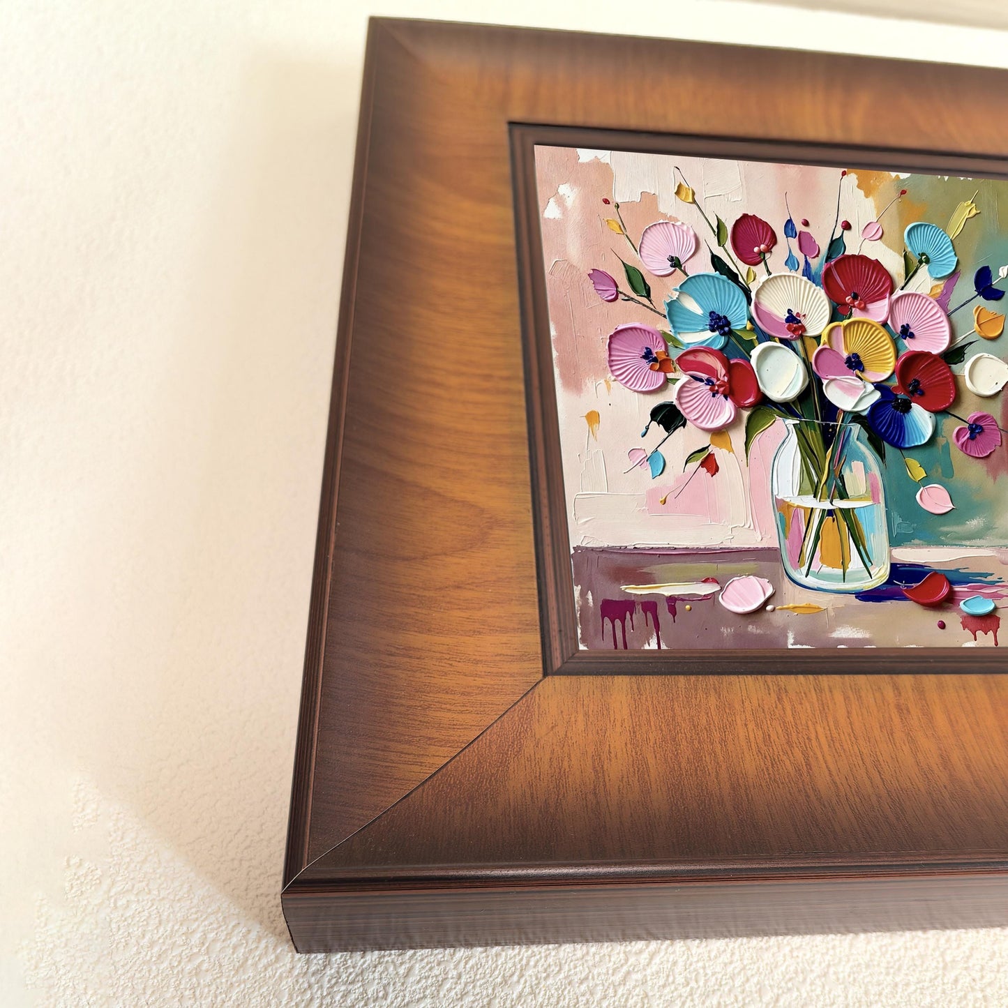 Extreme close-up of the corner of the wooden frame and the 3D palette knife texture of the colorful floral painting.