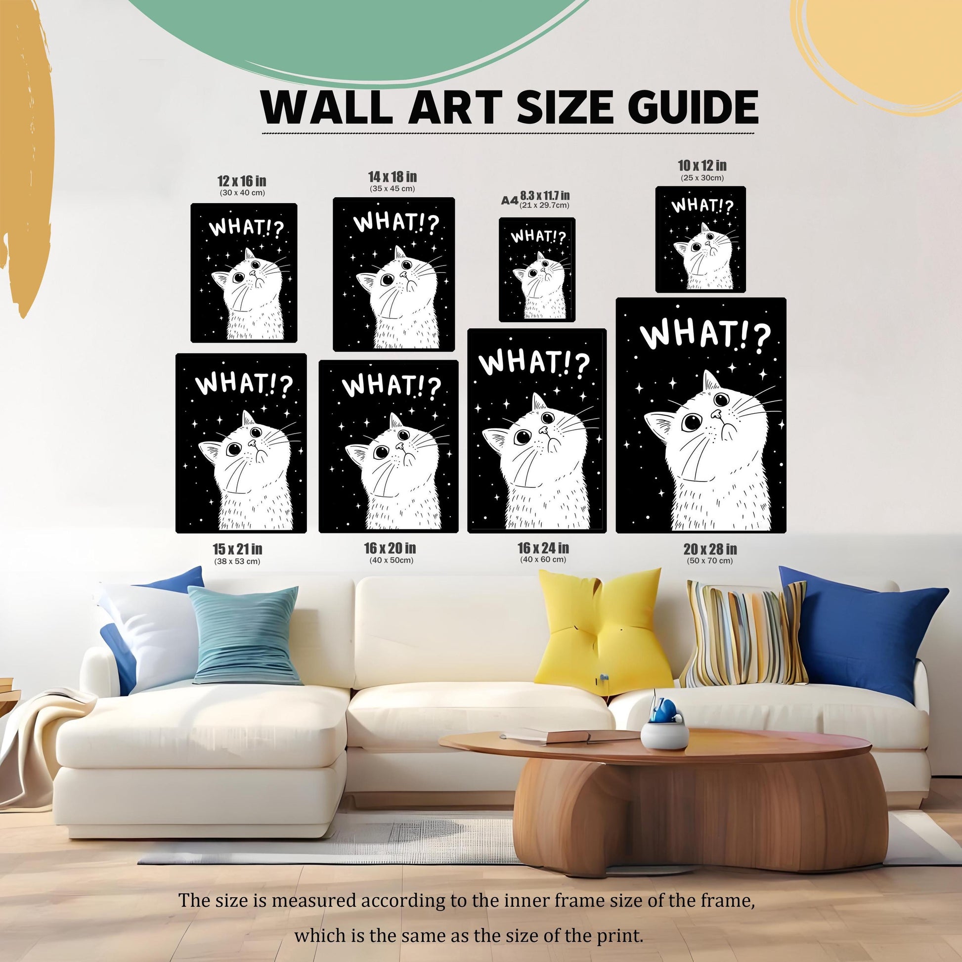 A wall art size guide showing the "WHAT!?" cat print in various sizes, from 10x12 inches to 20x28 inches, displayed above a light-colored couch.