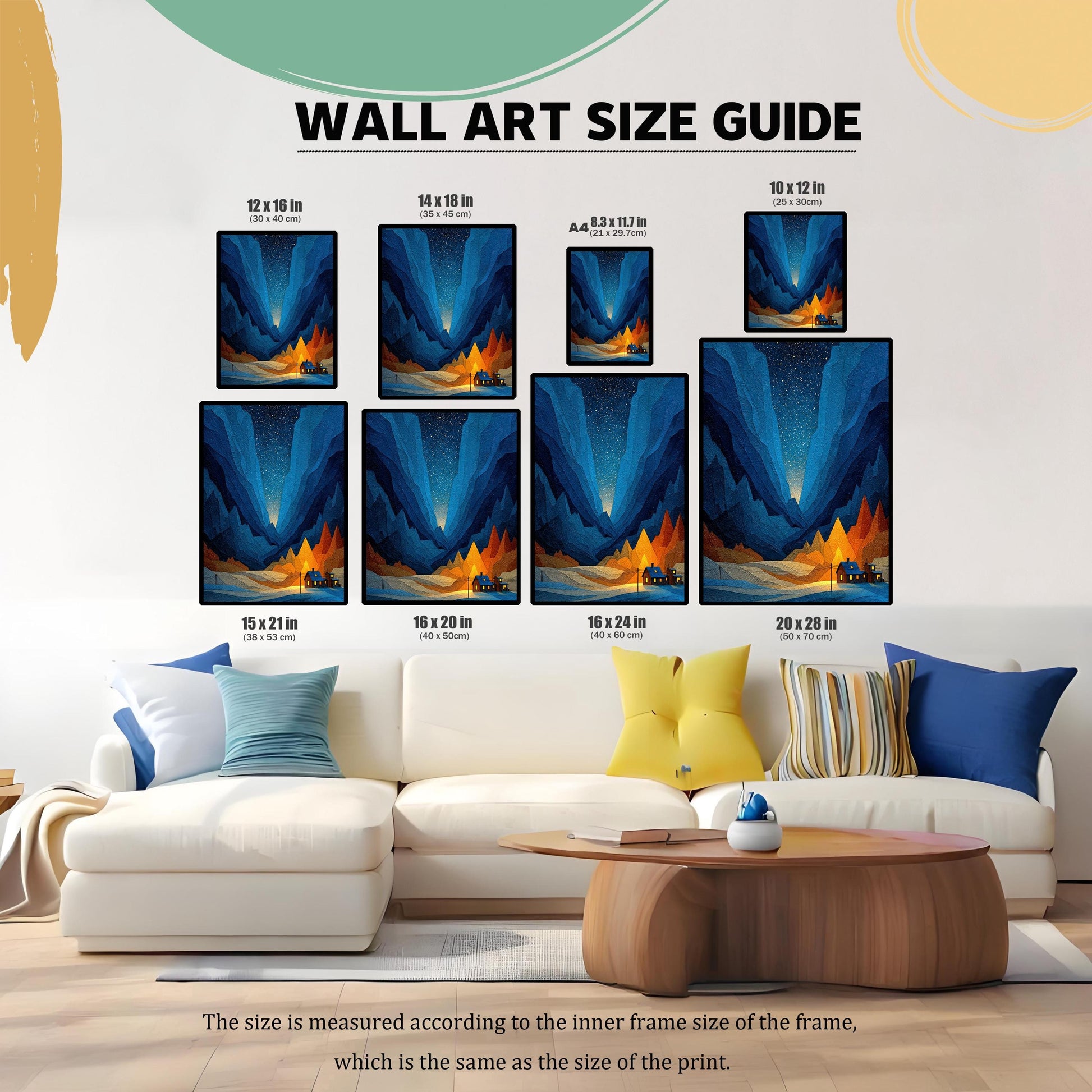 A ""WALL ART SIZE GUIDE"" image showing a framed print of a geometric mountain landscape with blue valleys and an orange glow around a cabin, displayed in eight different size options (12x16, 14x18, A4, 10x12, 15x21, 16x20, 16x24, 20x28 inches) above a white sectional sofa.