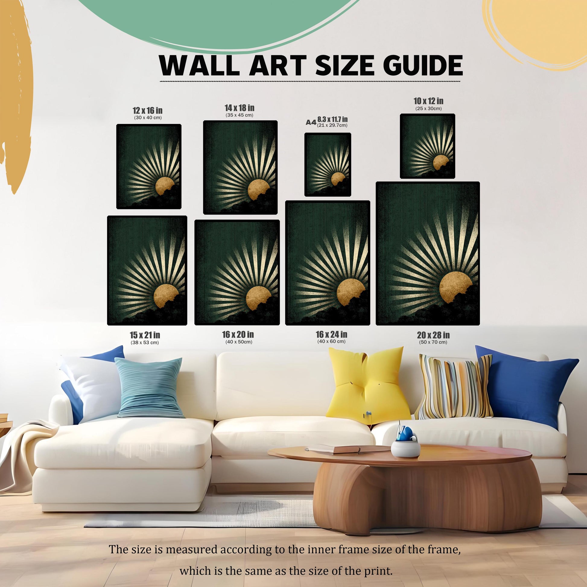 A Wall Art Size Guide graphic showing eight different framed sizes of the dark green and gold sunburst art print placed above a large white living room sofa. Sizes are listed in inches and centimeters (e.g., 12 x 16 in / 30 x 40 cm).