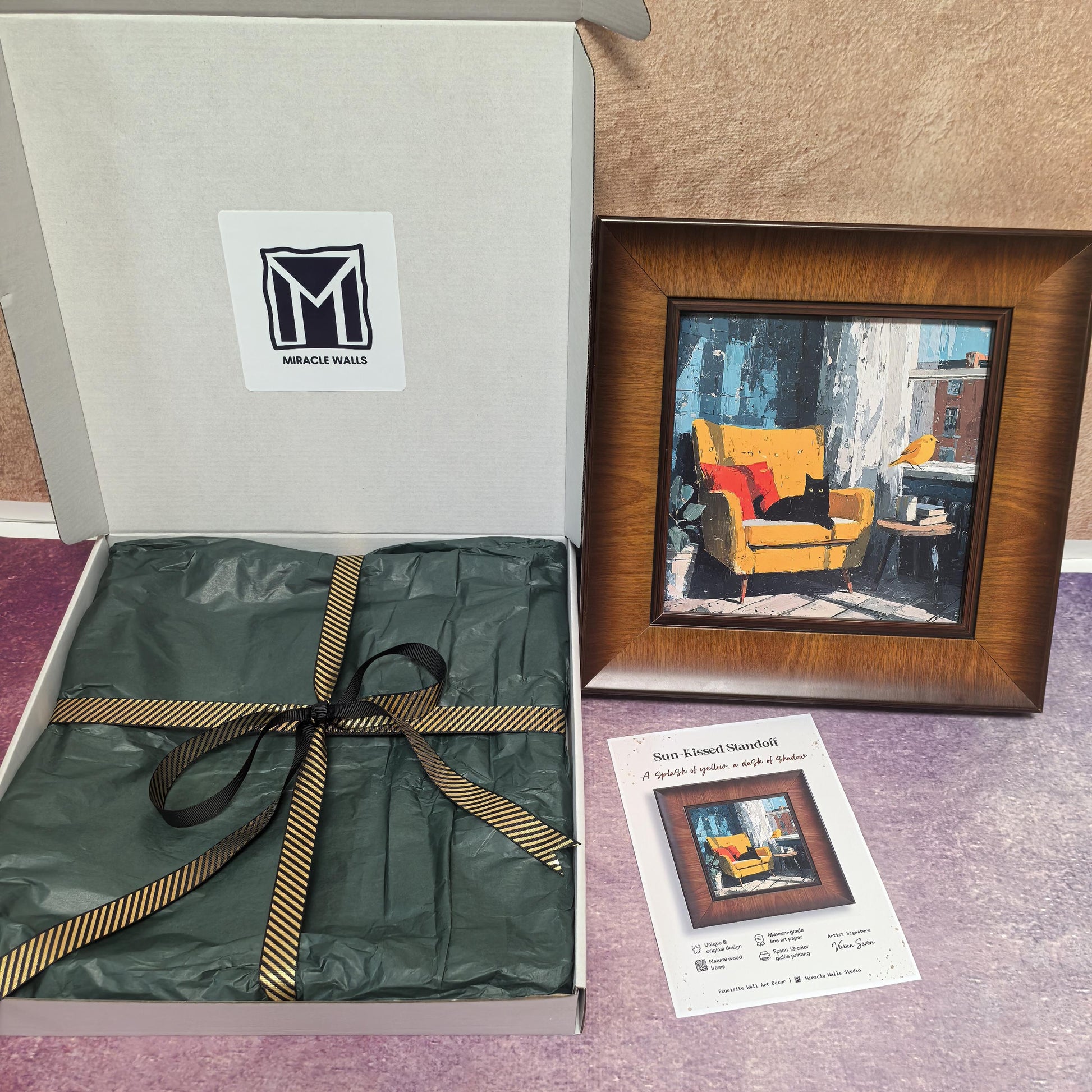 An unboxing display showing the "Sun-Kissed Standoff" framed print next to its open "Miracle Walls" gift box. The packaging includes premium green tissue paper and a gold-striped ribbon, with the product information card placed in the foreground.