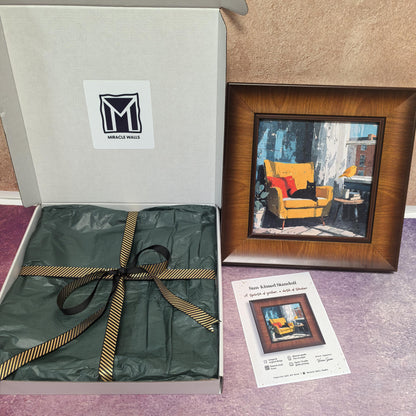 An unboxing display showing the "Sun-Kissed Standoff" framed print next to its open "Miracle Walls" gift box. The packaging includes premium green tissue paper and a gold-striped ribbon, with the product information card placed in the foreground.