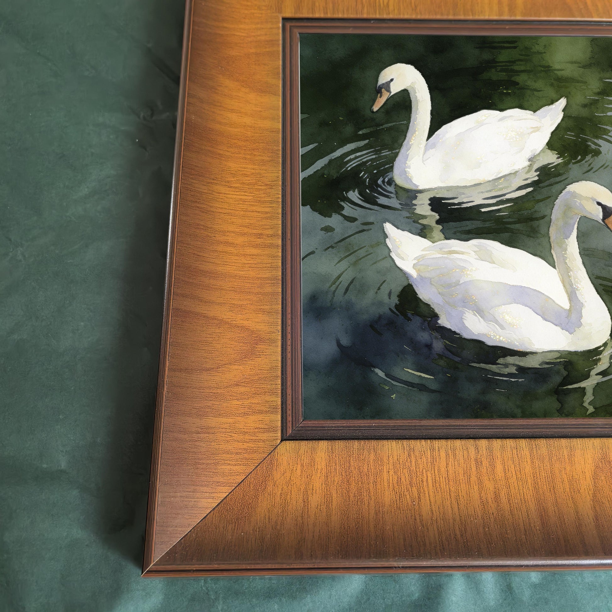 Close-up detail of the square wooden frame corner and the watercolor swan artwork, highlighting the wood grain and print texture.