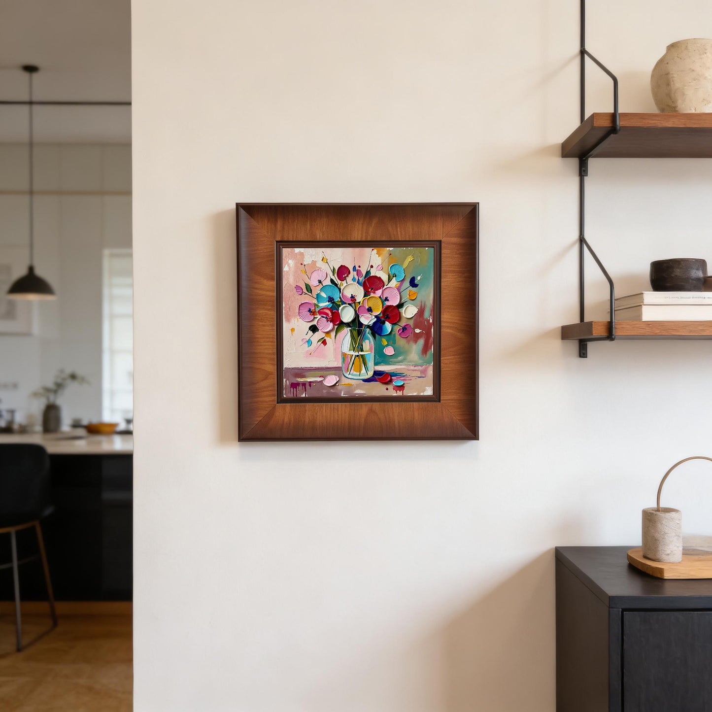 Frontal view of the square floral artwork hanging on a white wall, positioned between a hallway and a modern kitchen with black cabinetry.
