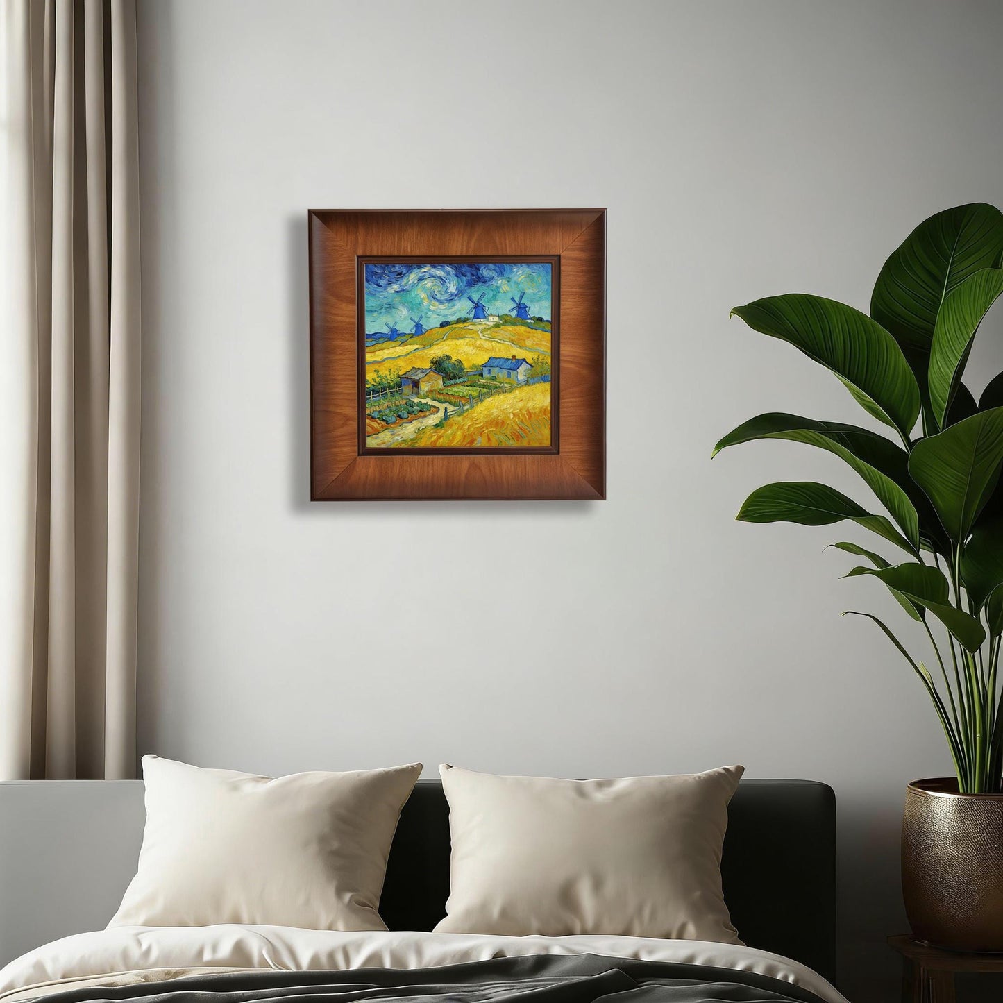 Square wood-framed Van Gogh style landscape painting centered on a minimalist white bedroom wall above a bed with white pillows.