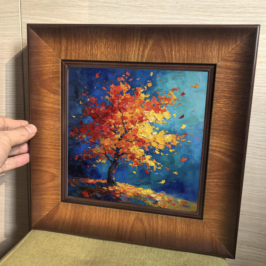 Hand holding a square wood-framed print to demonstrate the frame depth and high-quality finish of the wall art.