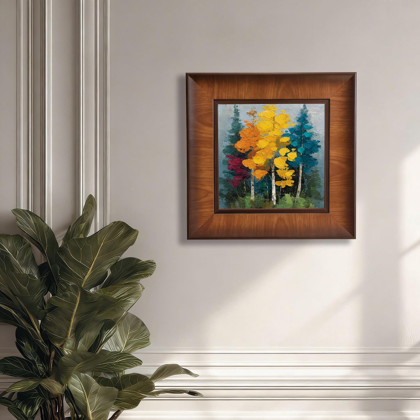 Square impasto forest painting in a wide walnut-finished wooden frame, hanging on a white wall with elegant molding and a large green plant.