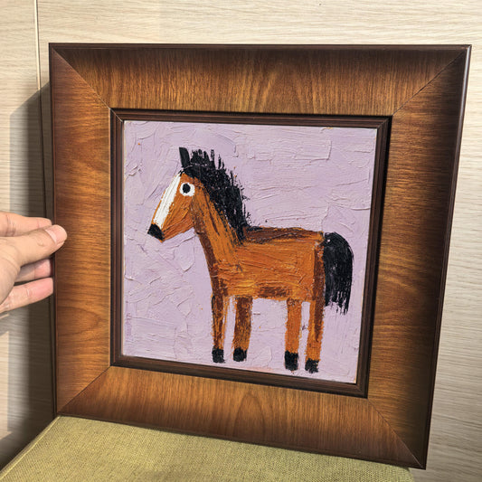 Close-up view of the square wooden frame being held, highlighting the deep beveled edge and the rich, warm wood grain finish.