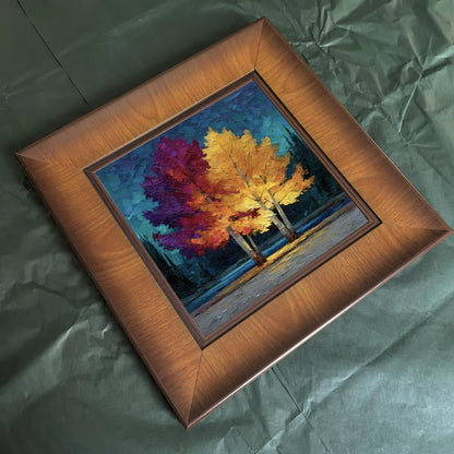 Overhead flat lay of the square wood-framed painting resting on dark green tissue paper, perfect for showing packaging or gift-ready quality.