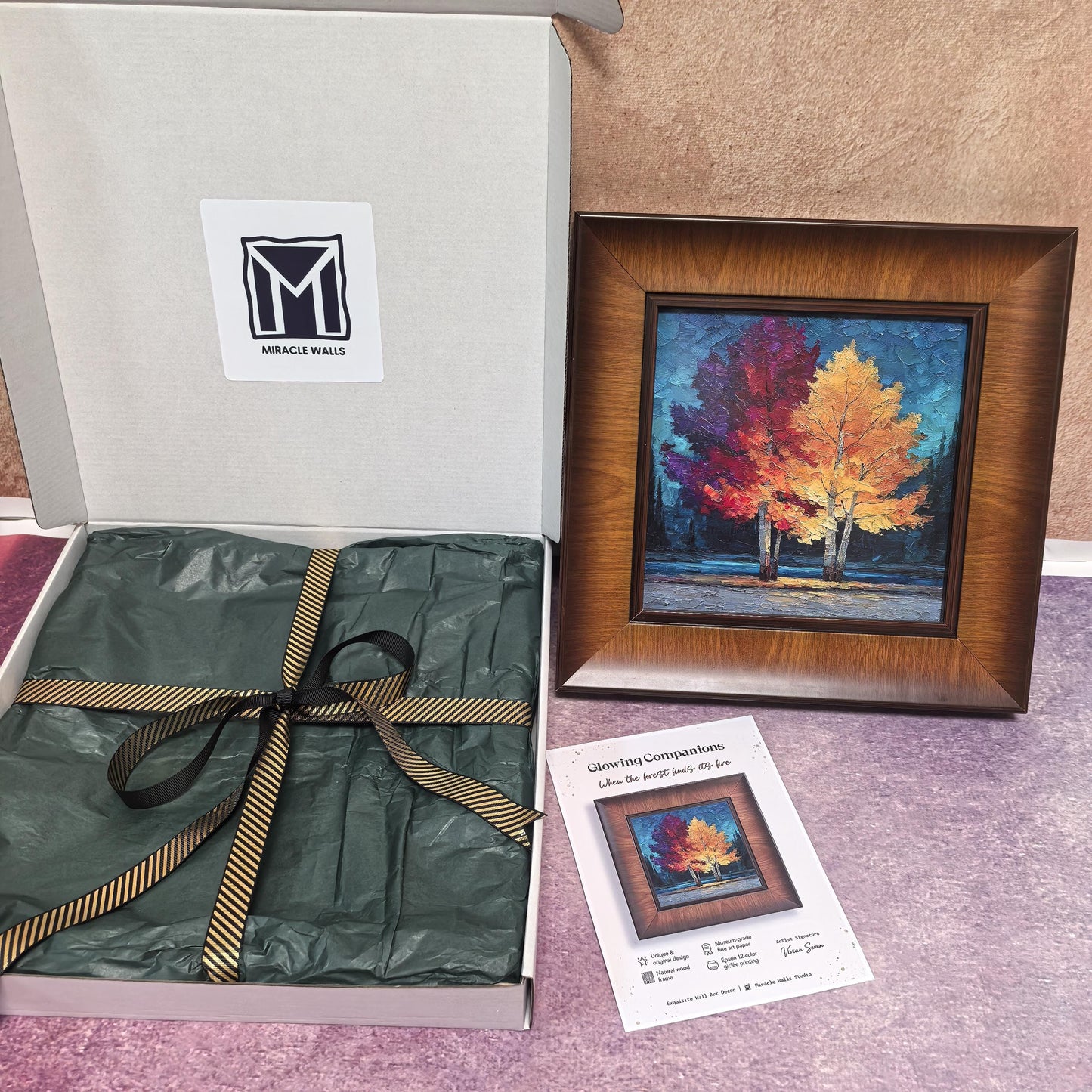 A detailed, front-facing view of the "Glowing Companions" artwork. It features two trees with vibrant, textured red and yellow leaves against a dark teal background, all within a thick, natural wood frame.