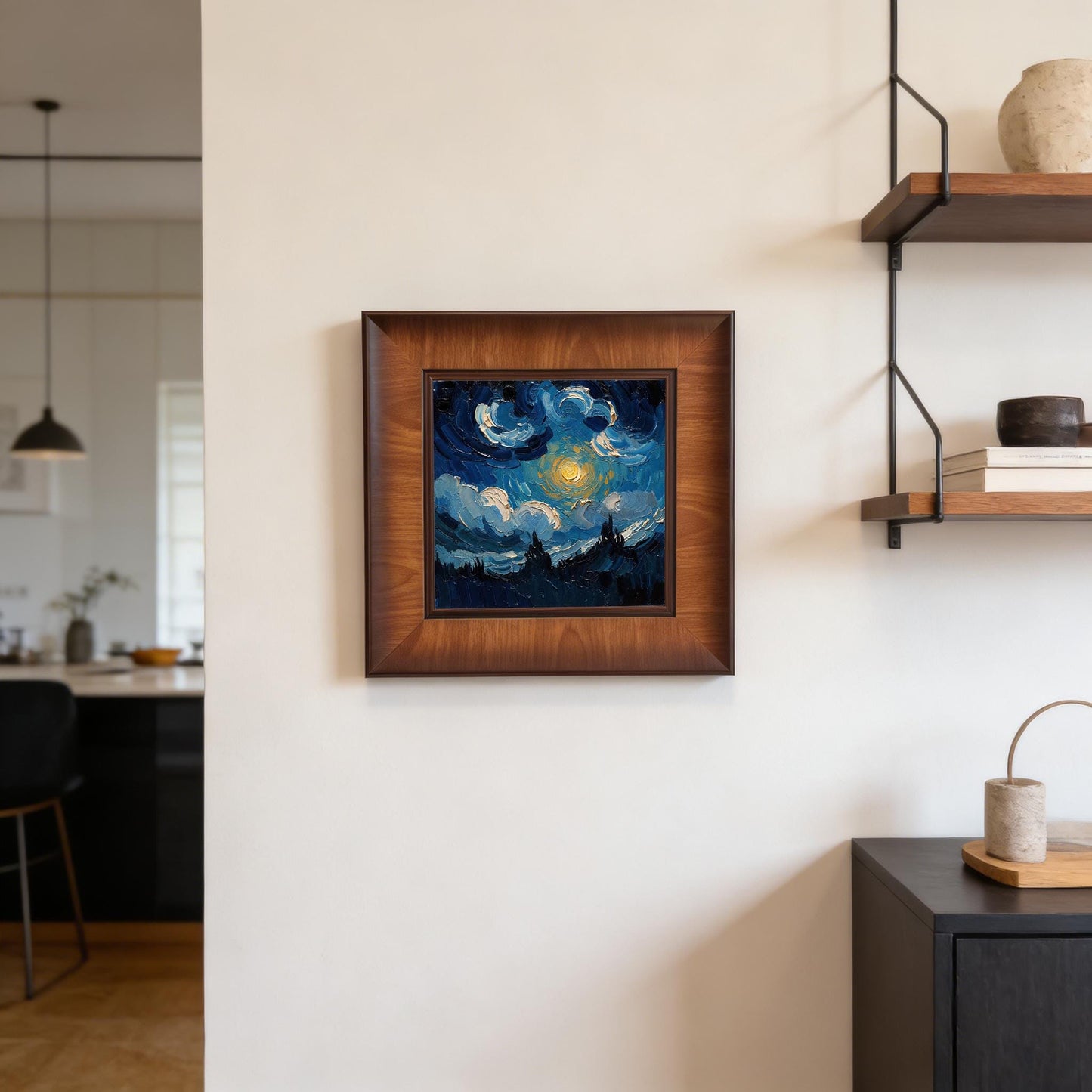 Close-up of a square wooden framed wall art piece hanging as part of a gallery wall set in a modern, bright dining area with minimalist furniture.