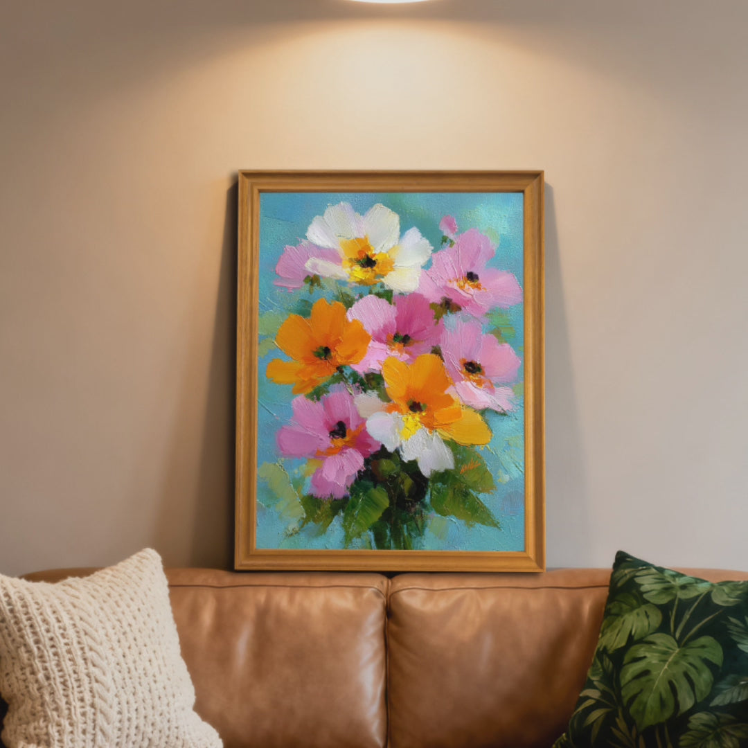 A short video showcasing a vibrant impasto oil painting of pink, orange, and white flowers in different interior settings. It begins with the painting in a light wood frame resting on a leather couch, then transitions to a black-framed version hanging above a sofa with orange pillows, eventually displaying a "Miracle Wall" logo overlay.